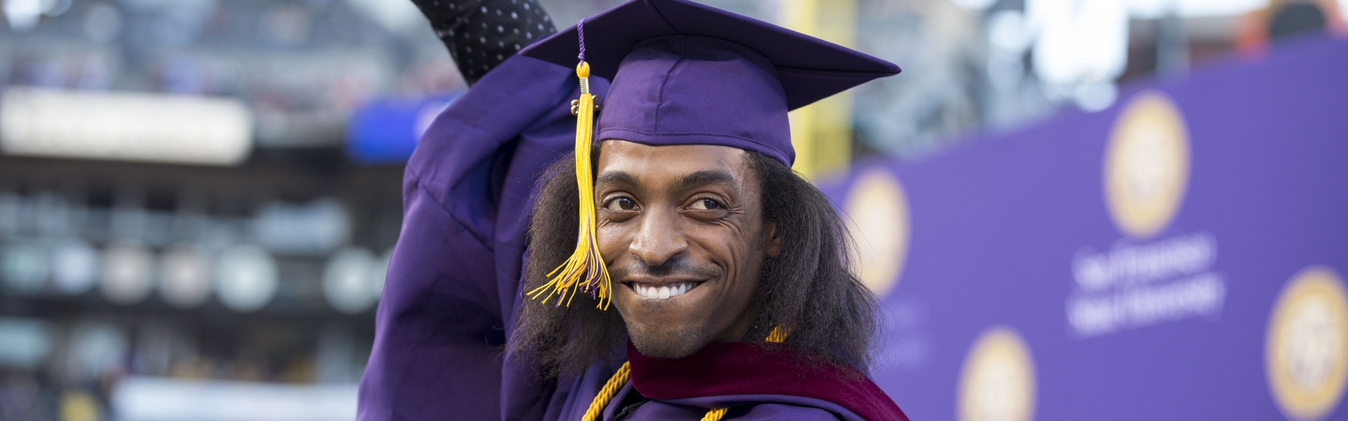 Man celebrates his graduation at commencement